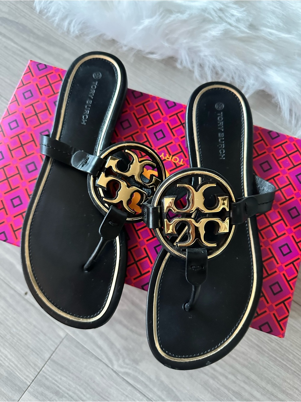 Tory Burch Black Thong Sandals with Gold Logo Medallion